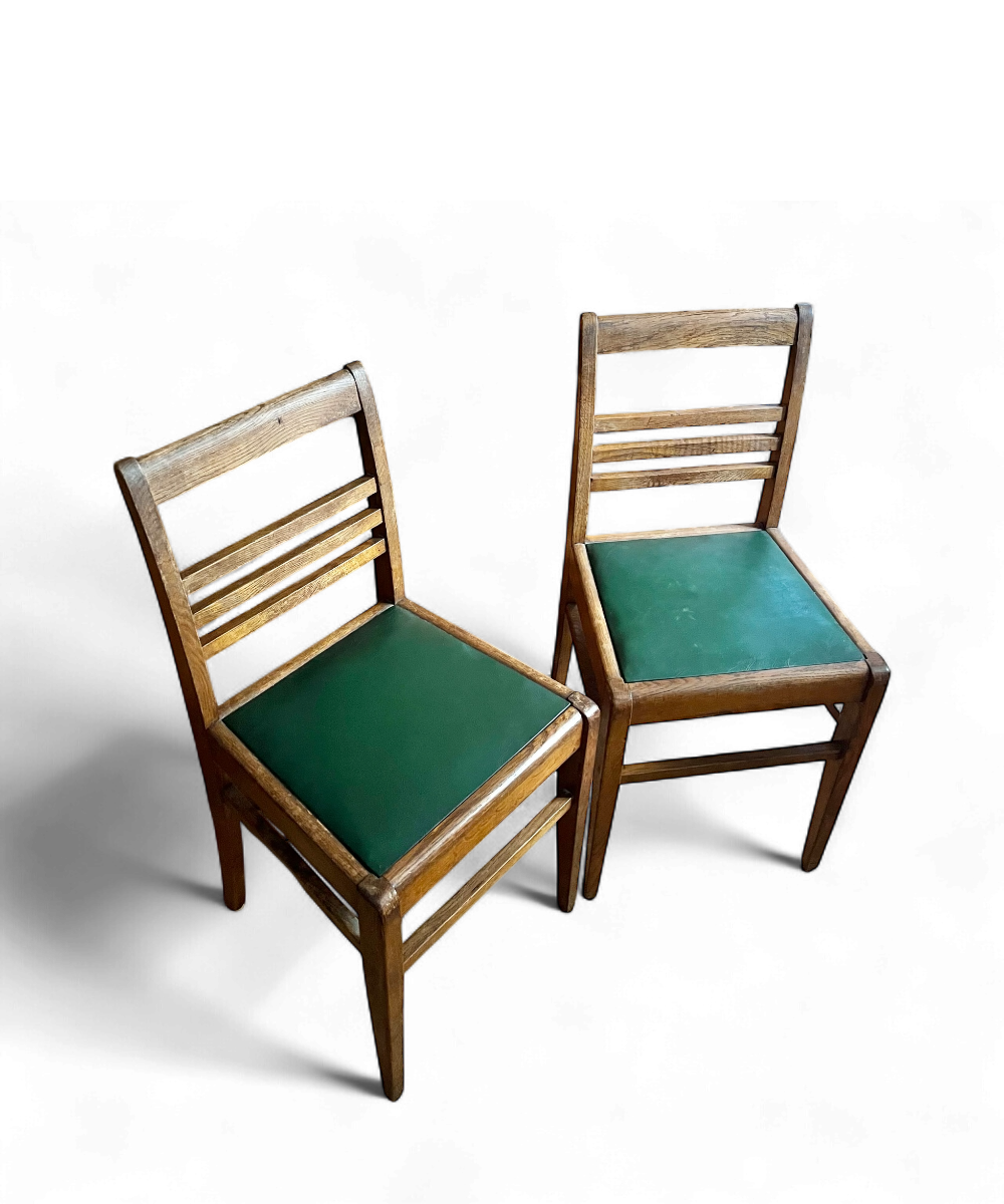 Chaise en chêne par René Gabriel, design français des années 1950, emblématique du mobilier de la Reconstruction.